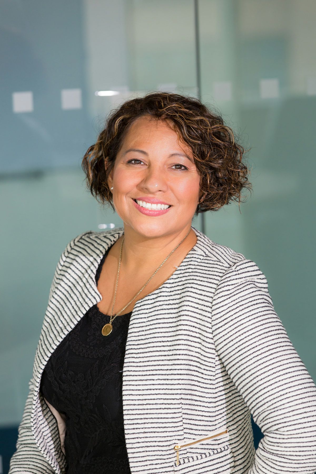 A smiling consultant in a bright office